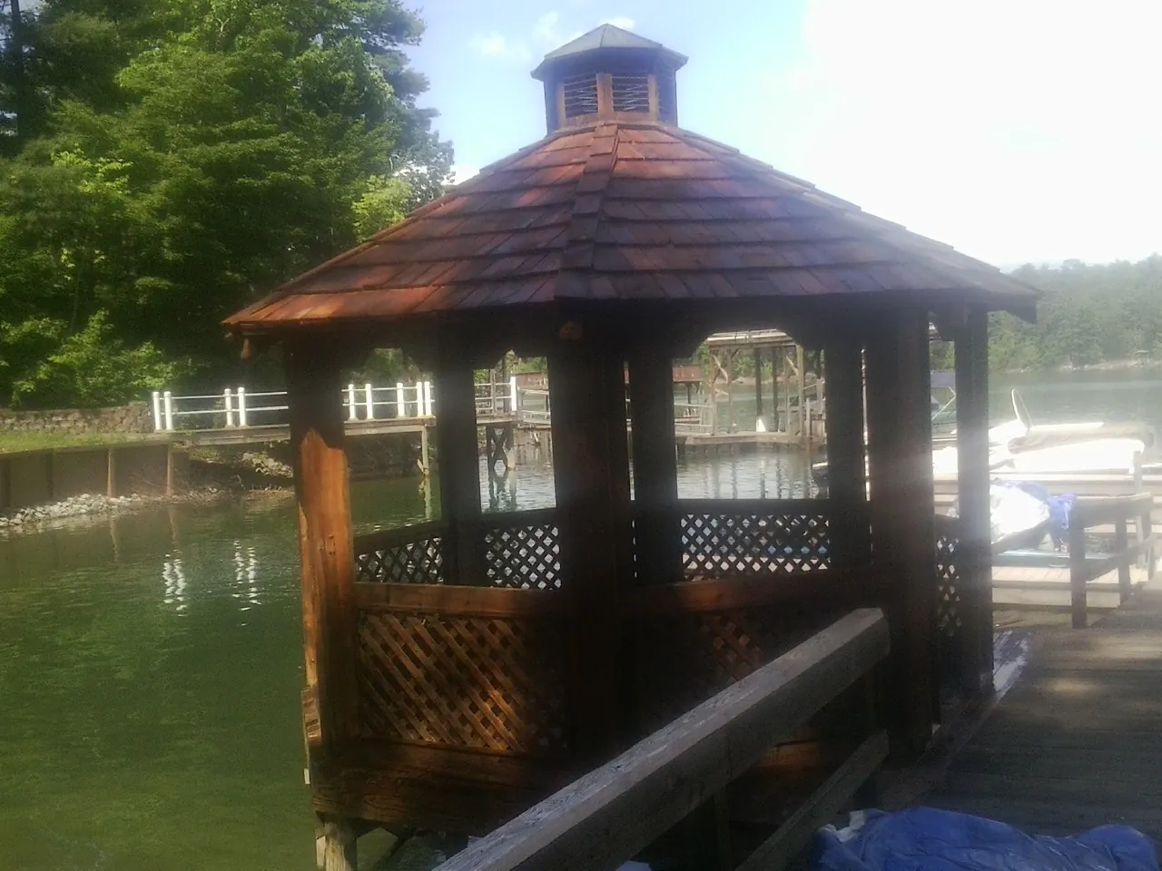 Cedar shake gazebo roof rebuilt on a lake dock in Chester